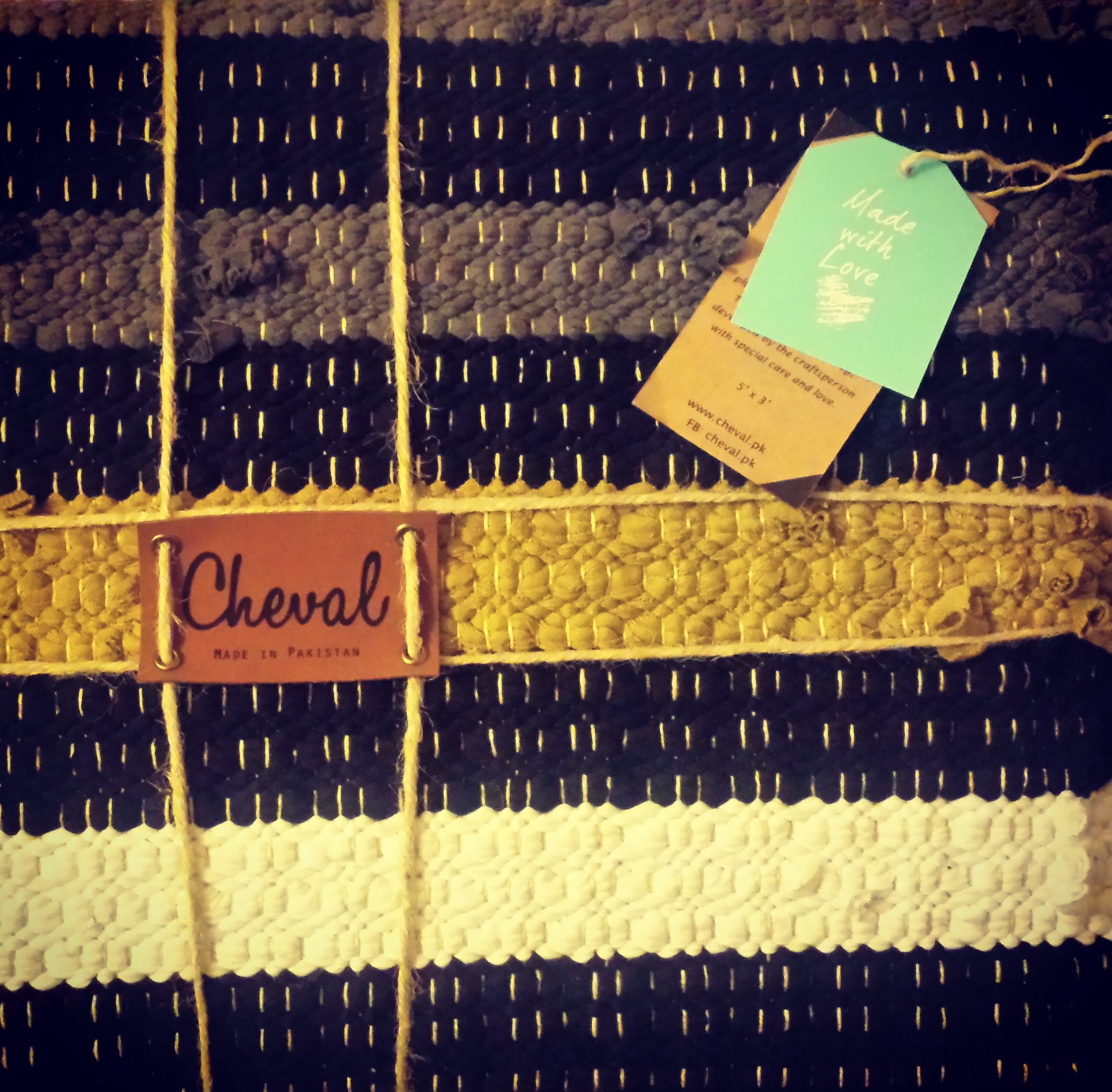 Finished Cheval rug with leather brand label and Made with Love hangtag