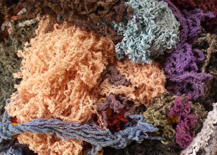 Pile of multicoloured cotton yarn used in Cheval rugs