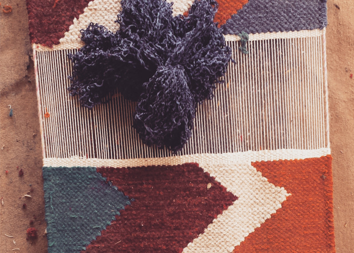 Geometric Cheval rug in progress on a loom